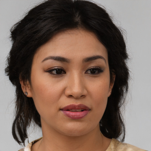 Joyful asian young-adult female with medium  brown hair and brown eyes