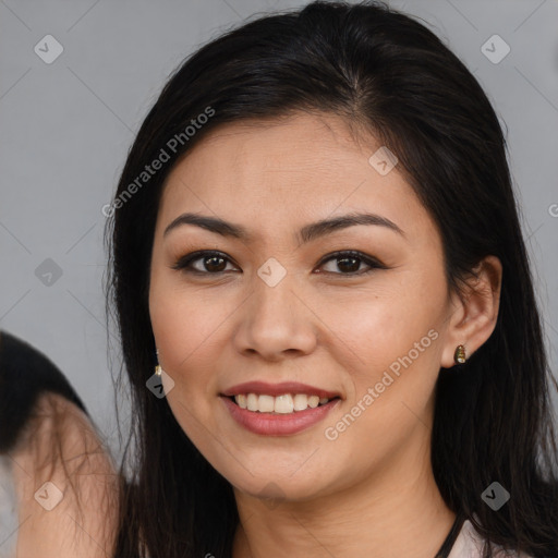 Joyful white young-adult female with long  brown hair and brown eyes