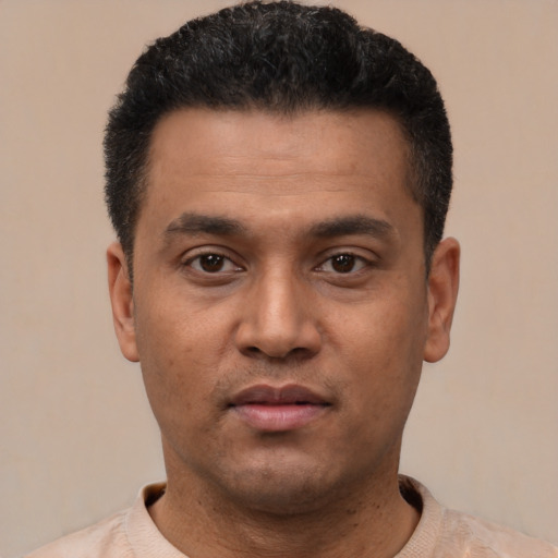 Neutral latino young-adult male with short  black hair and brown eyes