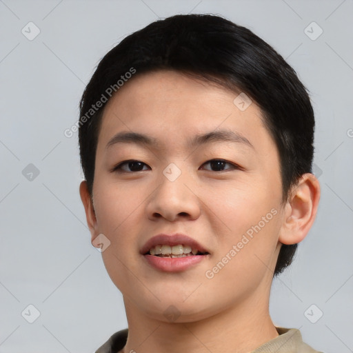 Joyful asian young-adult female with short  brown hair and brown eyes