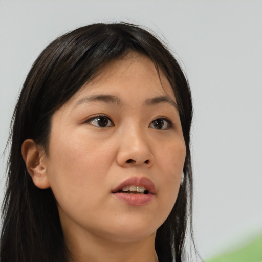 Neutral asian young-adult female with long  brown hair and brown eyes