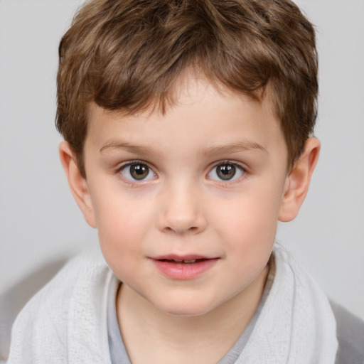 Joyful white child male with short  brown hair and brown eyes