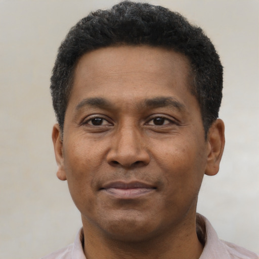 Neutral black adult male with short  black hair and brown eyes
