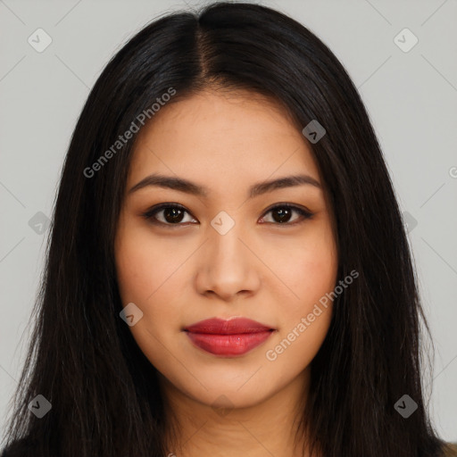 Joyful latino young-adult female with long  brown hair and brown eyes