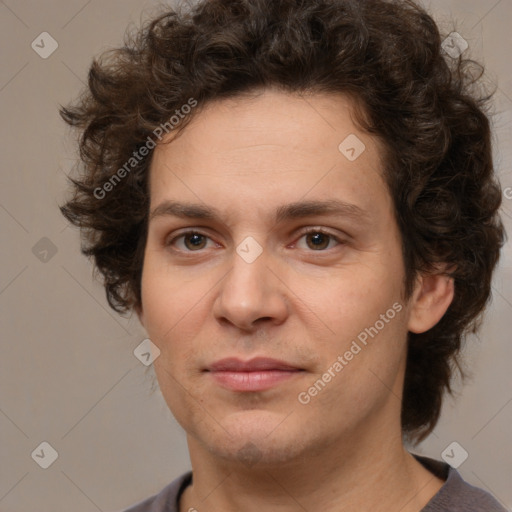 Joyful white young-adult male with medium  brown hair and brown eyes