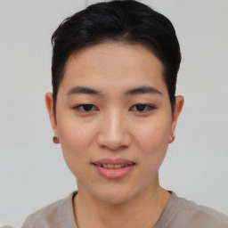 Joyful asian young-adult female with short  black hair and brown eyes