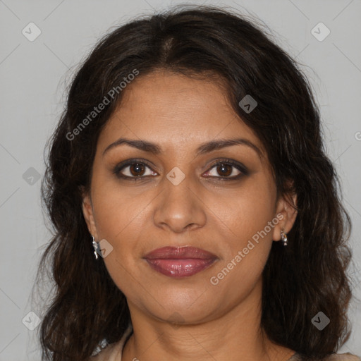 Joyful black adult female with medium  brown hair and brown eyes