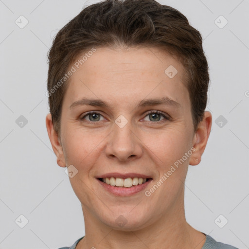 Joyful white young-adult female with short  brown hair and grey eyes