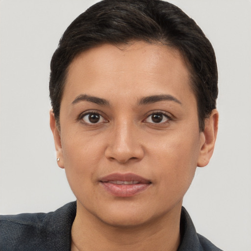 Joyful white young-adult female with short  brown hair and brown eyes