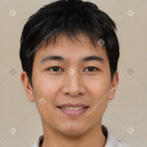 Joyful asian young-adult male with short  brown hair and brown eyes