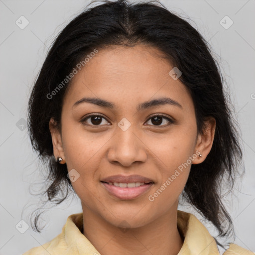 Joyful latino young-adult female with medium  brown hair and brown eyes