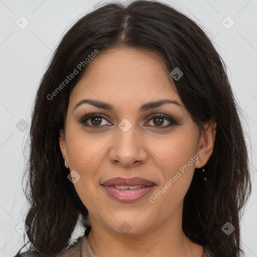 Joyful latino young-adult female with long  brown hair and brown eyes