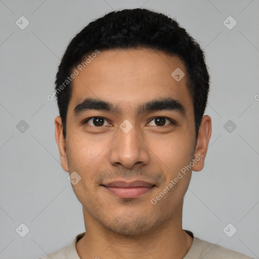 Joyful latino young-adult male with short  black hair and brown eyes