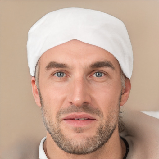 Joyful white adult male with short  black hair and brown eyes