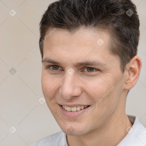 Joyful white adult male with short  brown hair and brown eyes