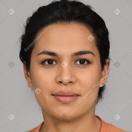 Joyful latino young-adult female with short  brown hair and brown eyes