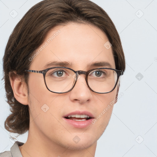 Joyful white young-adult male with medium  brown hair and brown eyes