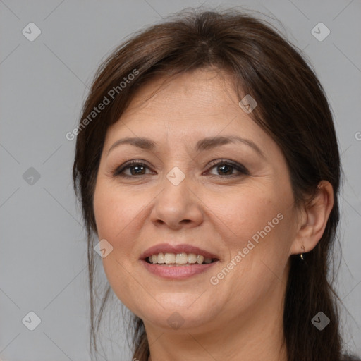 Joyful white adult female with medium  brown hair and brown eyes