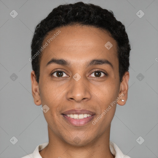 Joyful latino young-adult male with short  black hair and brown eyes