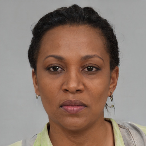 Neutral black adult female with short  black hair and brown eyes