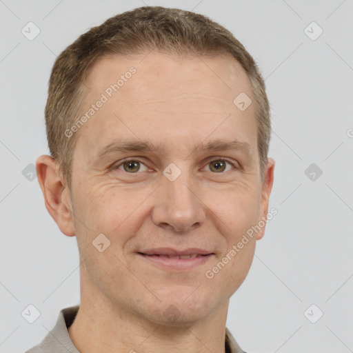 Joyful white adult male with short  brown hair and grey eyes