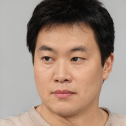 Neutral asian young-adult male with short  brown hair and brown eyes