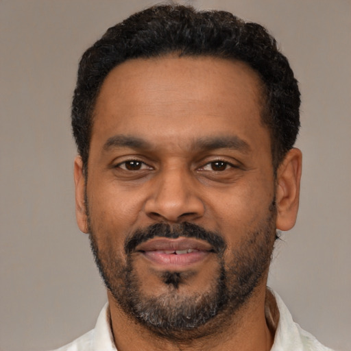 Neutral latino adult male with short  black hair and brown eyes