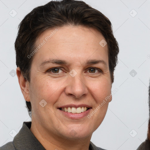 Joyful white adult female with short  brown hair and brown eyes