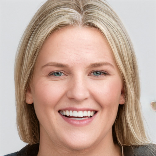 Joyful white young-adult female with medium  brown hair and blue eyes