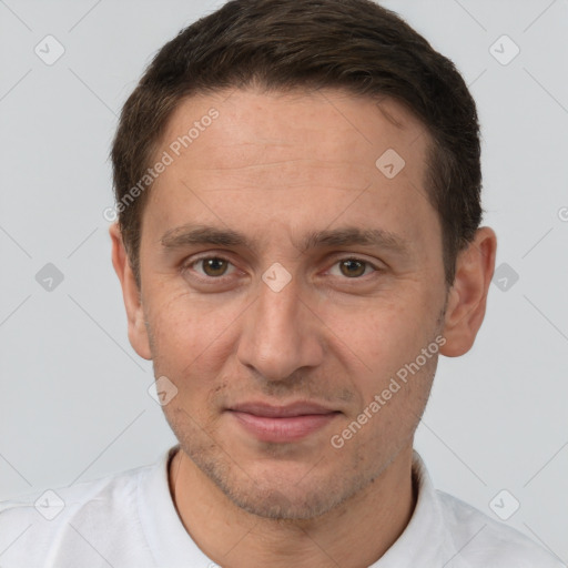 Joyful white adult male with short  brown hair and brown eyes