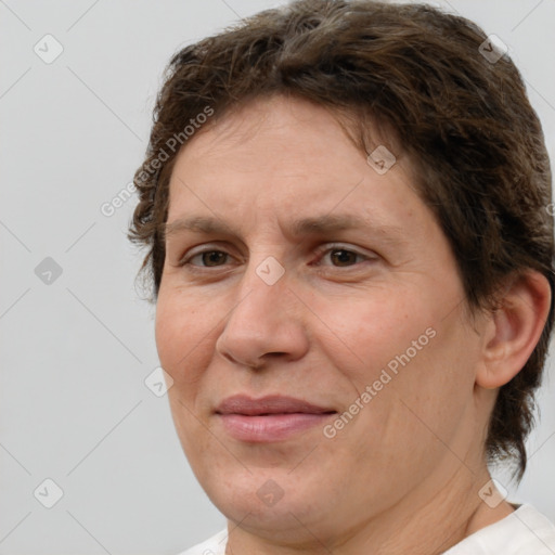 Joyful white adult female with short  brown hair and brown eyes