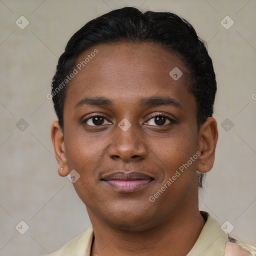 Joyful black young-adult female with short  black hair and brown eyes