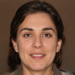 Joyful white adult female with medium  brown hair and brown eyes