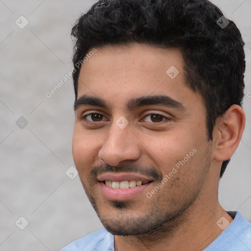 Joyful white young-adult male with short  black hair and brown eyes