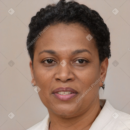 Joyful black adult female with short  brown hair and brown eyes