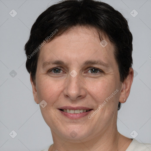 Joyful white adult female with short  brown hair and grey eyes