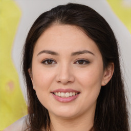 Joyful asian young-adult female with long  brown hair and brown eyes