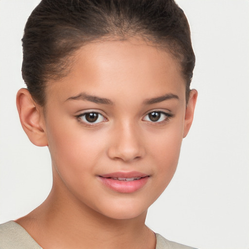 Joyful white child female with short  brown hair and brown eyes