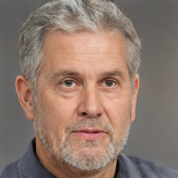 Neutral white middle-aged male with short  gray hair and brown eyes