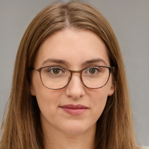 Joyful white young-adult female with long  brown hair and green eyes