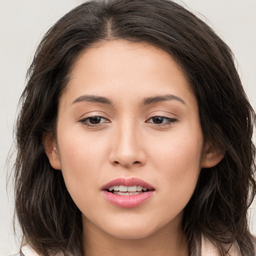 Joyful white young-adult female with long  brown hair and brown eyes