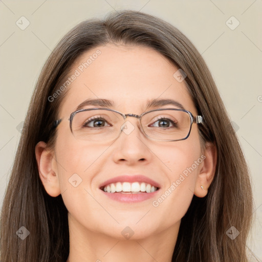 Joyful white adult female with long  brown hair and grey eyes