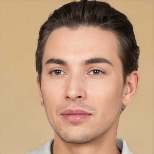 Joyful white young-adult male with short  black hair and brown eyes