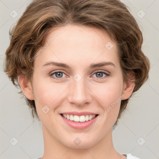 Joyful white young-adult female with medium  brown hair and green eyes