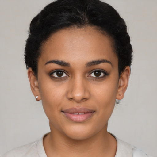 Joyful latino young-adult female with short  brown hair and brown eyes