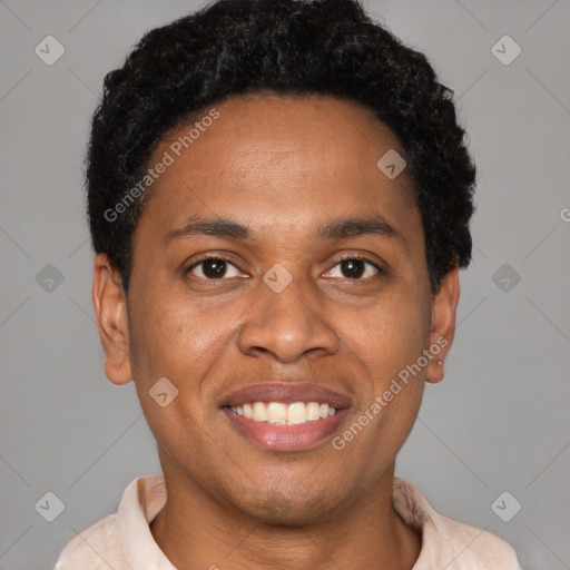 Joyful latino young-adult male with short  brown hair and brown eyes