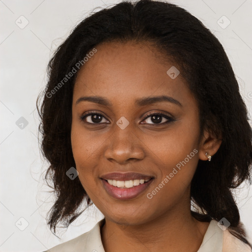 Joyful black young-adult female with medium  brown hair and brown eyes