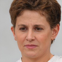 Joyful white adult female with short  brown hair and brown eyes