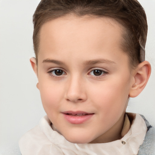 Joyful white child female with short  brown hair and brown eyes