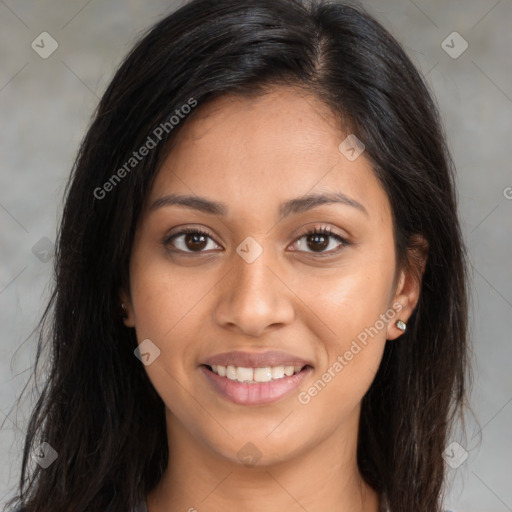 Joyful latino young-adult female with long  brown hair and brown eyes